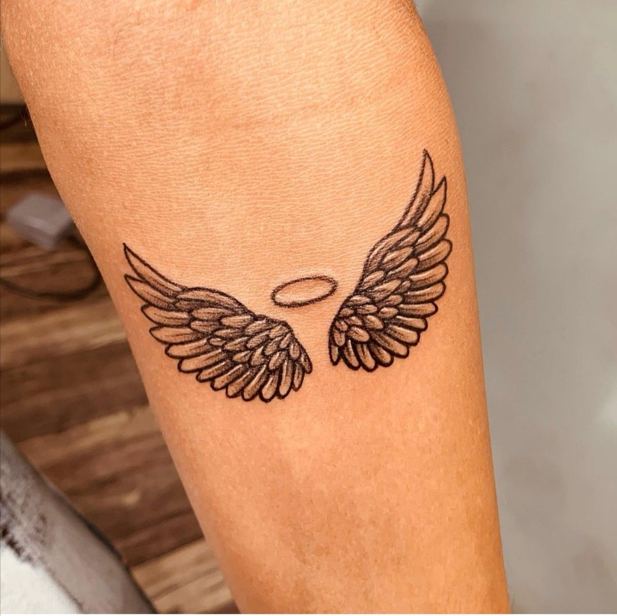 Premium Vector | Vector angel wings with ornament ring tattoo design