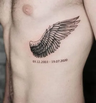 Angel Wings Tattoo on Rib
